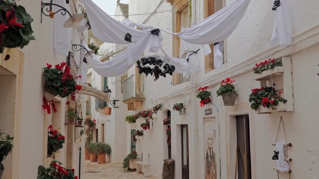 Walking charming white streets of Locorotondo in Puglia, Italy