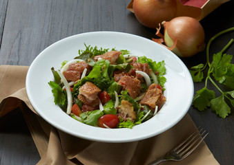 Yum spicy pork knuckle combine with onion decoration.