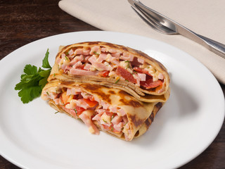 tasty pancake with ham cheese and tomatoes