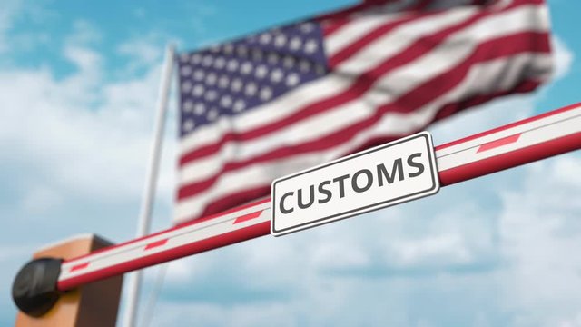 Closing boom barrier with CUSTOMS sign against the American flag. Border closure or protective tariffs in the USA