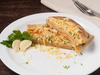 pancake khachapuri filled with cheese, herbs and garlic