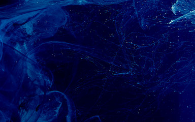  Digital strings matrix. Blue watercolor ink in water on a black background.