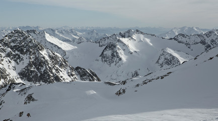 Obraz premium Austrian Mountains in the Alps of Tyrol. Alpine Winter landscape and mountain panorama in Europe. Glacier Stubaier Gletscher Skiing area near Innsbruck. Beautiful scenery