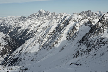 Fototapeta premium Mountains in Austria in the Alps of Tyrol. Alpine winter landscape in Europe. Glacier Stubaier Gletscher. Beautiful valley