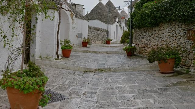 Walking streets of trulli town Alberobello, Italy