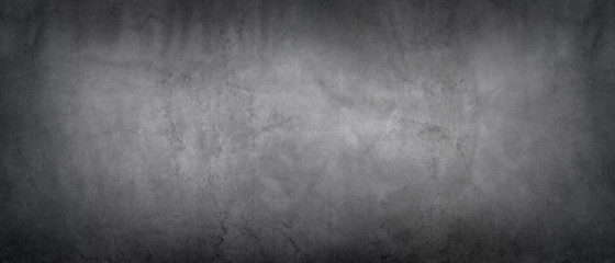 Dark gray wall with concrete texture and vignette as a background