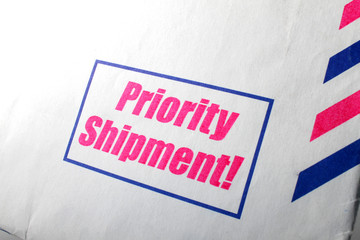 Priority shipment sign on empty letter envelope