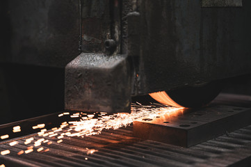 Industrial Processing of metal, grinder with sparks .