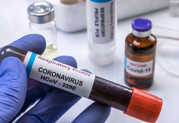 Scientist holds Codvid-19 coronavirus vaccine in hospital , conceptual image