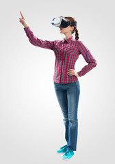 Beautiful girl using virtual reality glasses