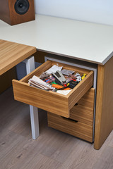 Wooden storage cabinet with open drawer. Wooden office furniture