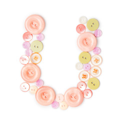Letter U from pink and green buttons isolated on white background. Sewing kit. Colorful buttons, stylish alphabet for handmaking hobby. Handmade sew abc. Text from buttons
