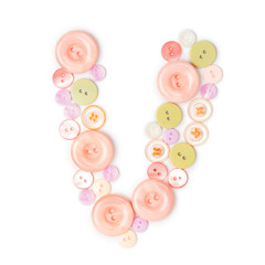 Letter V from pink and green buttons isolated on white background. Sewing kit. Colorful buttons, stylish alphabet for handmaking hobby. Handmade sew abc. Text from buttons