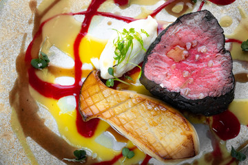 Filet mignon Beef steak with mushrooms and vegetables on a plate, food styling for serving in a...