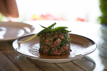 woman eating salad in restaurant