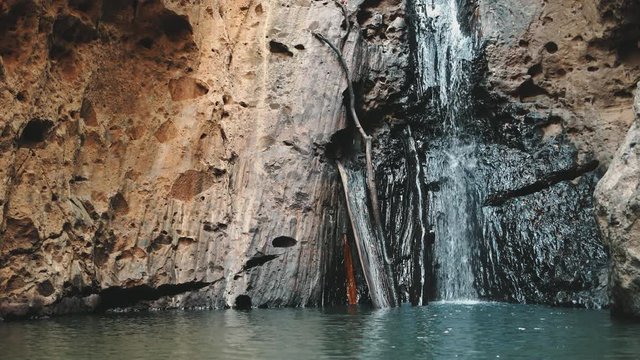 Pam Bok Waterfall Flowing Exotic Thailand Jungle. Stone Cliff, Wild Water Splashing into Pond Zoom out. Picturesque Chiang Mai Province Nature. Clear Stream Slow Motion. Footage Shot in 4K