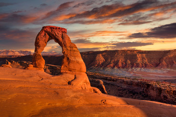 Delicate Arch at Sunset Under Stunning Skies - 323253582