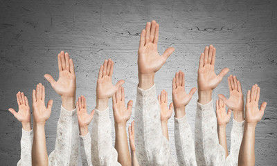 Row of man hands showing voting gesture
