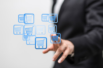 Businessman pressing modern technology panel shopping cart web phone credit card.