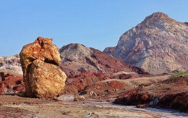 Fototapeta na wymiar Mountains of Hormuz with incredibly paradisaical Colors on the Iranian island of Hormuz