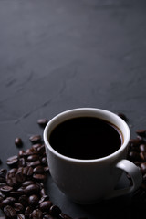 Coffee cup and beans on old grey kitchen beton , rock table. Top view with copyspace for your text