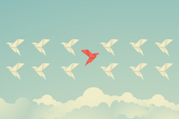 red bird changing direction and white ones. New idea, change, trend, courage, creative solution,business, innovation and unique way concept