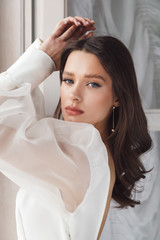 Fototapeta premium Portrait of elegant beautiful bride wearing fashion wedding dress. Perfect makeup and hairstyle