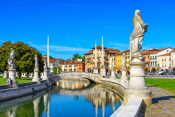 View of canal with statues on square Prato della Valle in Padova (Padua), Veneto, Italy