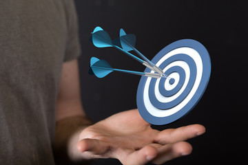 arrow hitting in the target center of dartboard on bullseye.