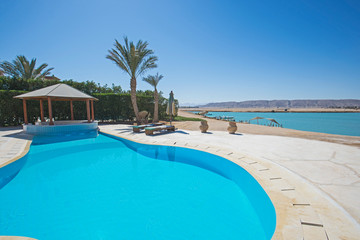 Swimming pool at at luxury tropical holiday villa resort