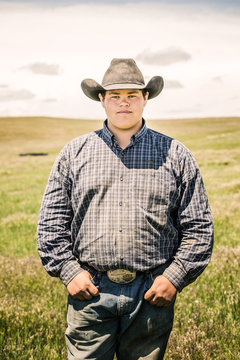 Portrait of cowboy in the pen after a branding. Cody, Wyoming, USA