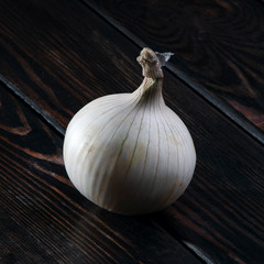 White onion on wooden background.
