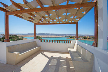 Roof terrace balcony with lagoon view in luxury villa