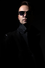 Fototapeta premium Agent on a mission. A man with a gun.
