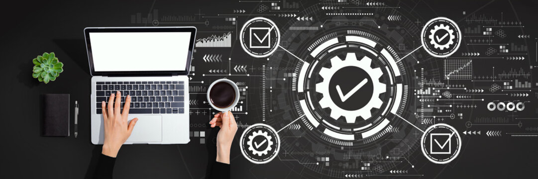 Quality control approval with person using a laptop computer