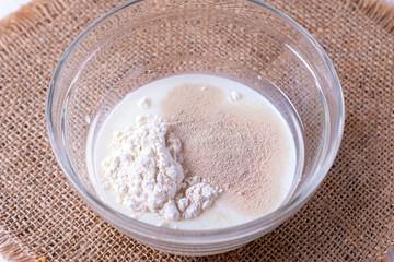 Yeast and flour in a glass bowl