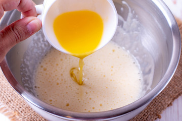 Pour the butter into the dough