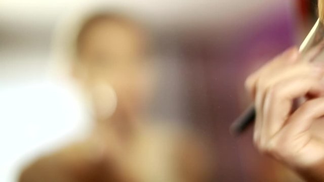 girl looks in the mirror, not pleased with the appearance, pulls the skin. Ugly, aging skin. Allergic to cosmetics, fear of aging, under eye circles, wrinkles. Low self-esteem, dysmorphic disorder. 