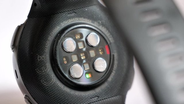 Heartbeat pulse measurement device flashing. Close up, shallow focus