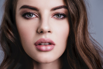 Beautiful face of sexy young woman. Portrait of a beautiful woman with a long hair. Young  brunette...