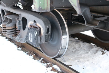 Wheel element of a train running on rails. The photo was taken in natural daylight.