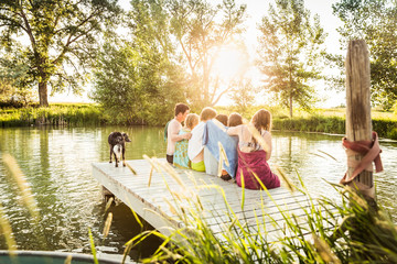 Group of young adults having fun in a swimming lake. Bridger, Montana, USA