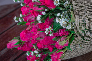 Close-up flower view(pink, red rose)that is beautifully decorated as a bouquet, placed on the table or garden to give on special days(Valentine,wedding)
