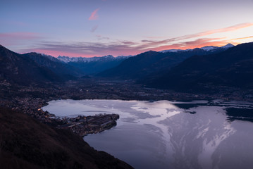 Fototapeta na wymiar Romantic scenic view of the sunrise at Iseo Lake with alps in the background
