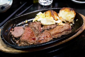 Japan grilled Hida beef put on hot metal plate
