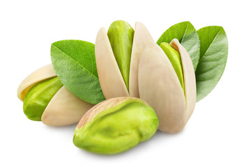 Delicious pistachios with leaves, isolated on white background