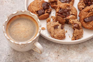 cup of coffee and cookies on  table