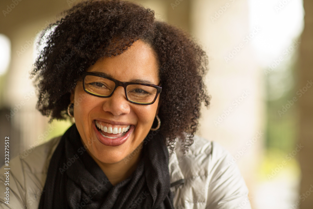 Wall mural confident happy african american woman smiling outside