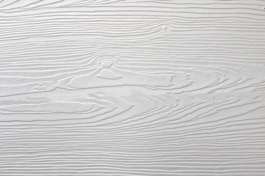 white shera wood panels are patterned like real wood.