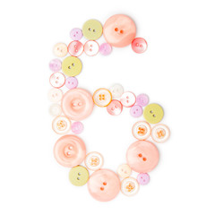 number 6 from pink and green buttons isolated on white. Sewing kit. Colorful button number six, stylish alphabet for handmaking hobby. Handmade sew abc. Text from buttons. Sale of sewing furniture